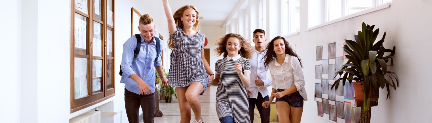 Teenage students jumping