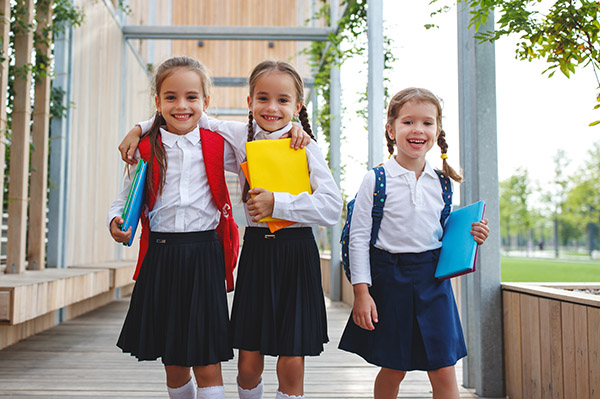 Girls with school backpacks